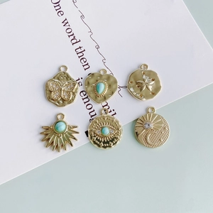 Bohemian gold plated charms set featuring evil eye butterfly and turquoise heart pendants
