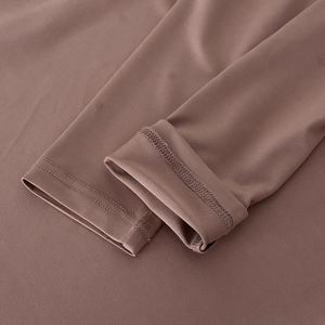 Detailed close-up of espresso brown dress showing high-quality double-stitch sleeve seams