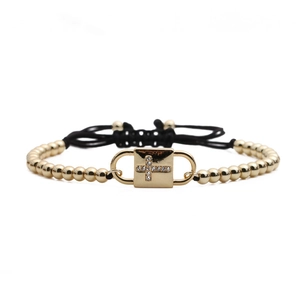 Adjustable black cord bracelet featuring a gold zircon cross pendant and copper beads