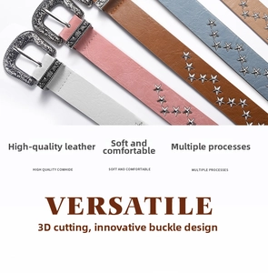Detail of vintage cowhide belts featuring western carved buckles and metal star studs
