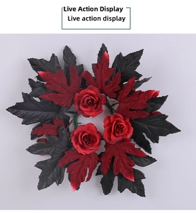 Detail of gothic Halloween candle ring with red roses and dark maple leaves decor