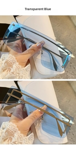 Detail of transparent blue oversized sunglasses with silver rivets and leather pouch