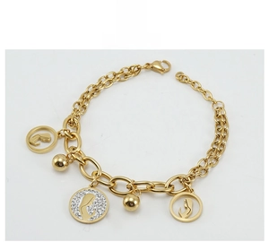Detail of 18K gold-plated double-layer bracelet with portrait charms and crystals