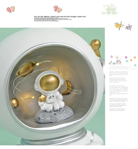 Close-up of resin astronaut night light with LED copper wire lights and moon base