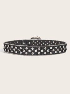 Detailed view of the black leather belt featuring silver studs and sparkling rhinestones