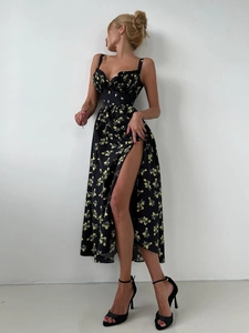 Detail view of floral sundress with lemon print and elegant high side slit design