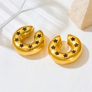Gold stainless steel star pattern ear cuffs with hollow design on white background