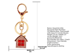 Detailed view of pink rhinestone house keychain with size specs and lobster clasp
