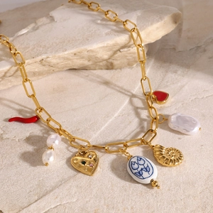 18k gold stainless steel necklace with chili, baroque pearl and heart charms on stone
