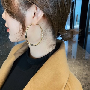 S925 silver needle large gold hoop earrings shown on model with polished metal finish