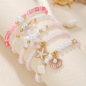 Multilayer beaded bracelet set with starfish and shell charms for beach style