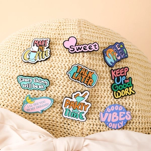 Set of 9 creative cartoon enamel pins with positive English quotes on a straw hat