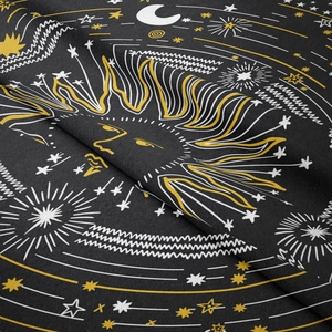 Detailed fabric texture of a black tarot tapestry with gold celestial sun and stars
