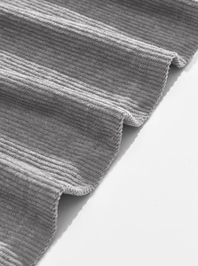 Macro shot of grey corduroy fabric texture for polo sweatshirt showing ribbed material detail