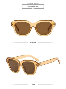 Detail view of square tortoiseshell sunglasses with brown lenses and metal dot rivets