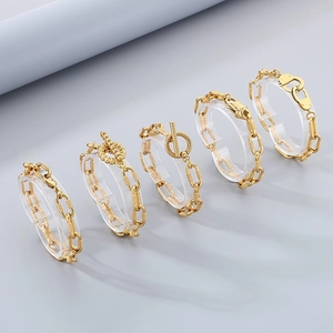 Various 10mm gold titanium steel chain bracelets featuring handcuffs and OT buckle designs