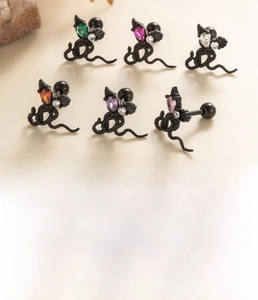 Detailed macro view of black bat cartilage studs with colorful heart zircon stones