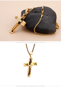 Detail of gold cross pendant with wire-rope texture and thick twisted rope chain