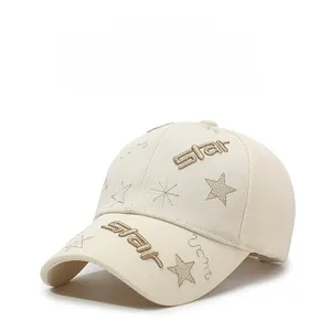 Detail shot of star embroidery and premium texture on cream baseball cap front