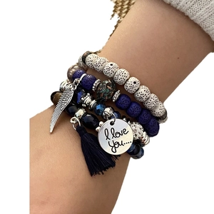 Bohemian multilayer beaded bracelet set with blue stone, tassel and wing charm