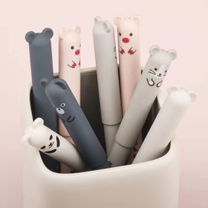 Cute cartoon animal erasable gel pens in a white holder with soft pink background