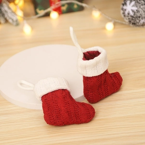 Mini knitted Christmas stockings with red stripes and white cuffs for holiday decoration