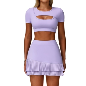 Two-piece lavender yoga tennis set with cutout crop top and pleated mini skirt