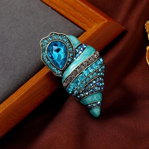 Vintage conch brooch with blue crystal teardrop and teal enamel in bronze finish