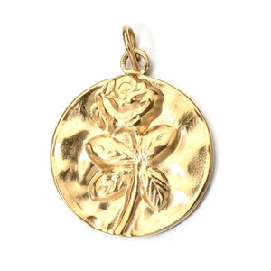 Detailed view of a gold round rose pendant with hammered texture and top bail attachment