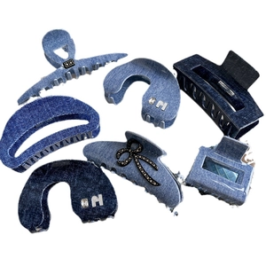 Collection of blue denim acetate hair claws with rhinestones for women's hair styling