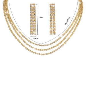 Detail showing dimensions of golden rhinestone necklace and long drop earrings set
