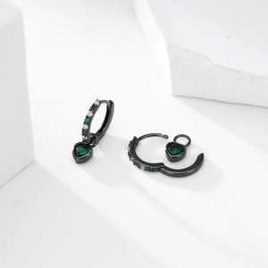 Detail of S925 silver heart drop earrings with green zircon and black metal finish