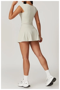 Detail view of the back of a slim-fit sports set featuring a T-shirt and mini skirt