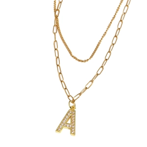Double-layered gold necklace featuring a zircon-inlaid letter A pendant on dual chains