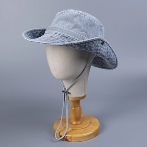 Detail of light blue washed denim sun hat with adjustable drawstring and wide brim