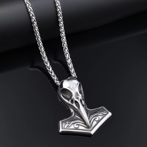 Antique silver Viking Mjölnir hammer necklace with crow skull and Norse pattern carvings