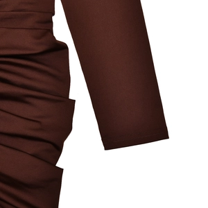 Detail showing smooth sleeve cuffs and ruching texture on dark brown ruched dress