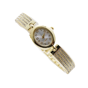 Luxurious gold oval women's watch with shimmering rhinestones and quartz movement