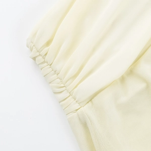 Detailed macro view of the breathable mesh knit fabric and elastic ribbed cuff texture