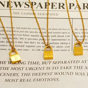 18k gold-plated padlock pendant necklace with engraved letter charms on vintage paper