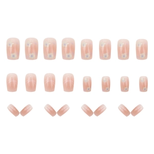 Short cute floral press-on nails set with pink base and white flower patterns