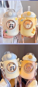 Detail of cute 3D panda and dog figurines inside bubble windows on kids water bottles