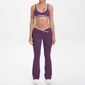 Detail of high-waisted crossover flare pants and v-neck bra in purple with white trim