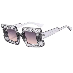 Modern square large frame sunglasses with grey textured resin and purple gradient lenses
