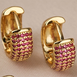 Gold-plated copper hoop earrings featuring micro-pave pink cubic zirconia stones