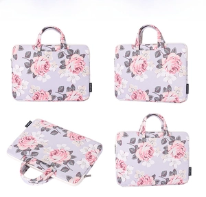 Detailed multi-angle view of lavender laptop bag with pink rose floral pattern and handle
