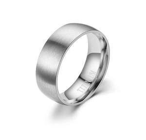 Macro shot of silver titanium ring showing brushed texture and inner mirror polish finish