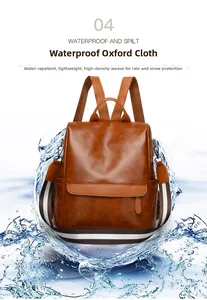 Detail showing water-resistant synthetic leather on a caramel brown travel backpack