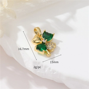 Detailed view of 14k gold-plated clover pendant with green zircons and dimension marks