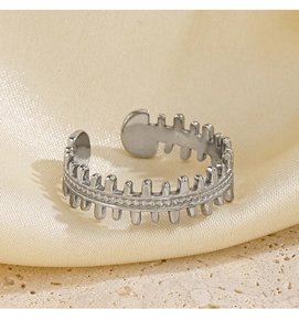 Detailed view of silver adjustable fishbone ring with unique texture on satin